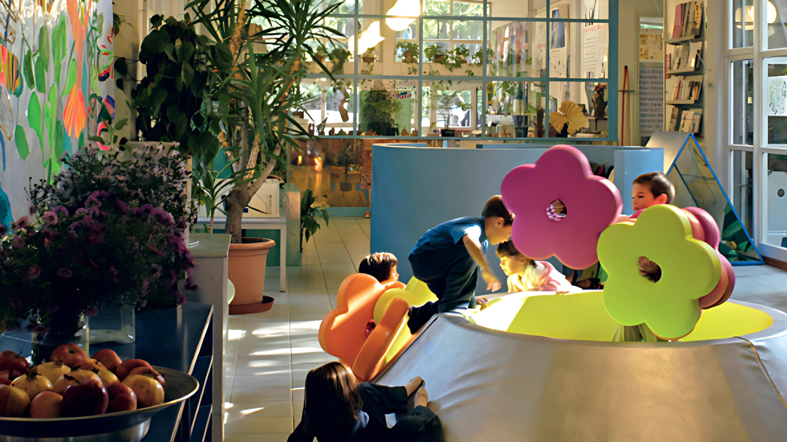 Children exploring a Reggio Emilia-inspired classroom with modular PLAY+ furniture made in Italy.