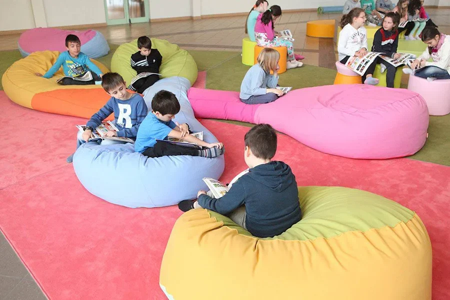 Cosy soft seating cushions in an early years learning environment