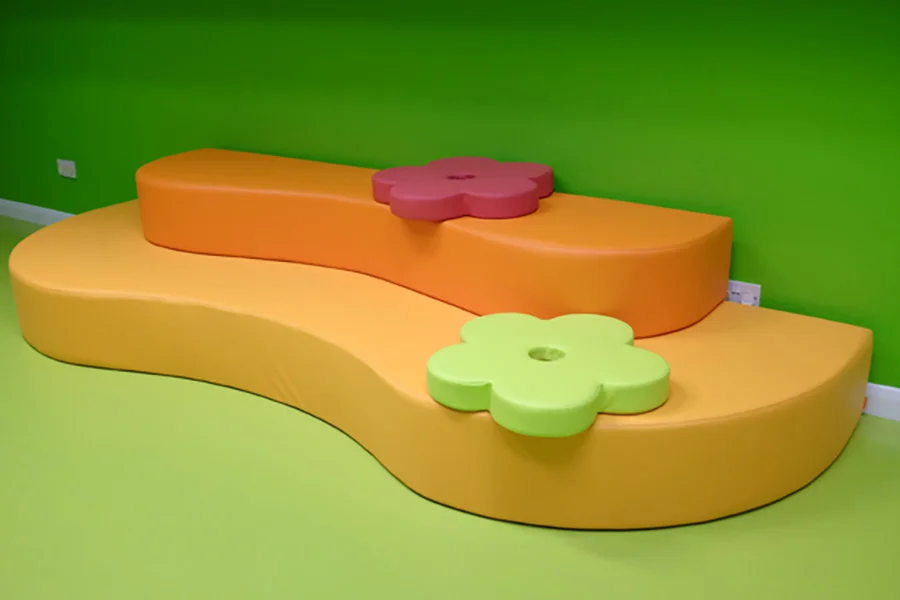Custom multi-level play and seating landscape in an early years classroom