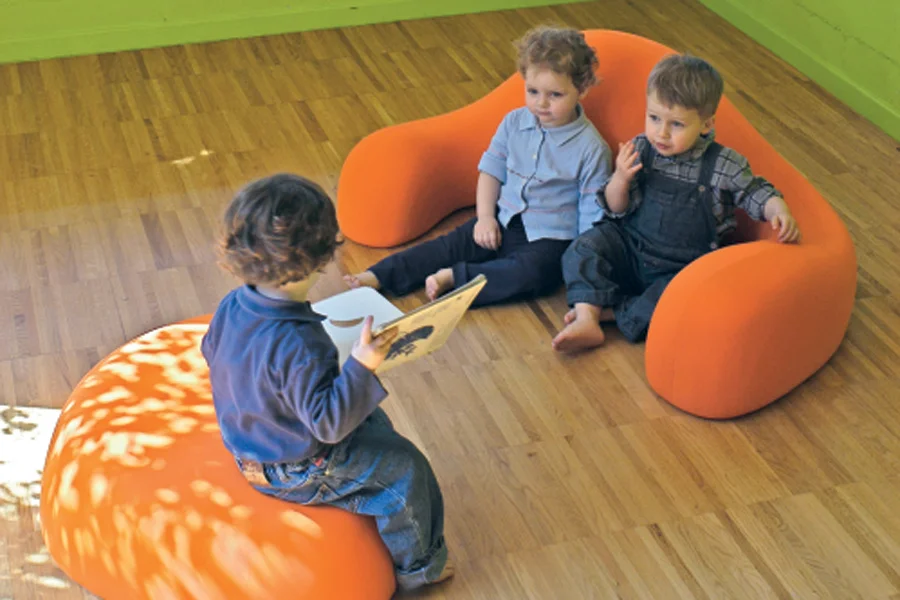 Children sharing books in Atoll retreat seating