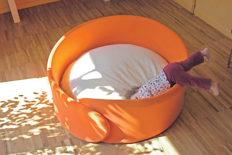 Children using Cocoon enclosed retreat space for quiet play and wellbeing in an early years classroom
