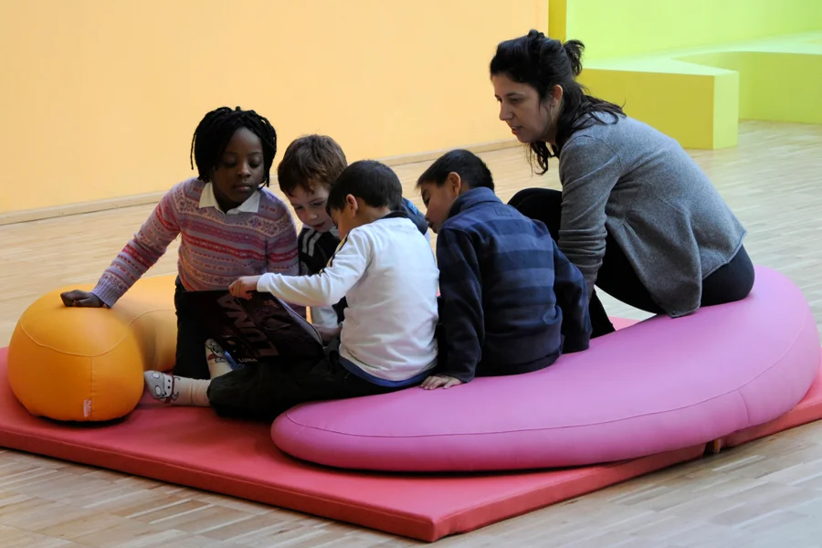 Flexible comma seating arranged as a reading corner